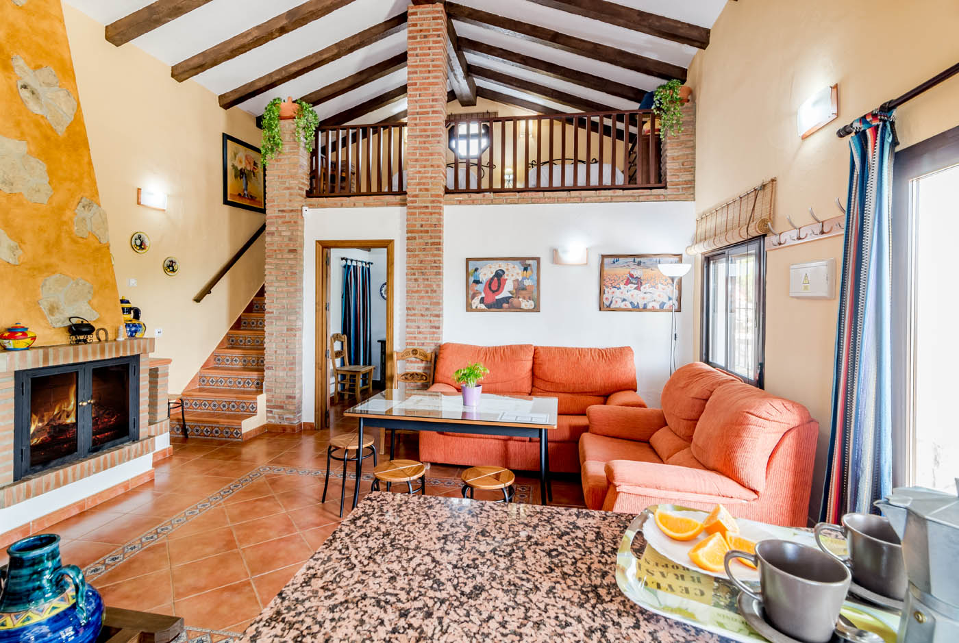 Living space with mezzanine room above