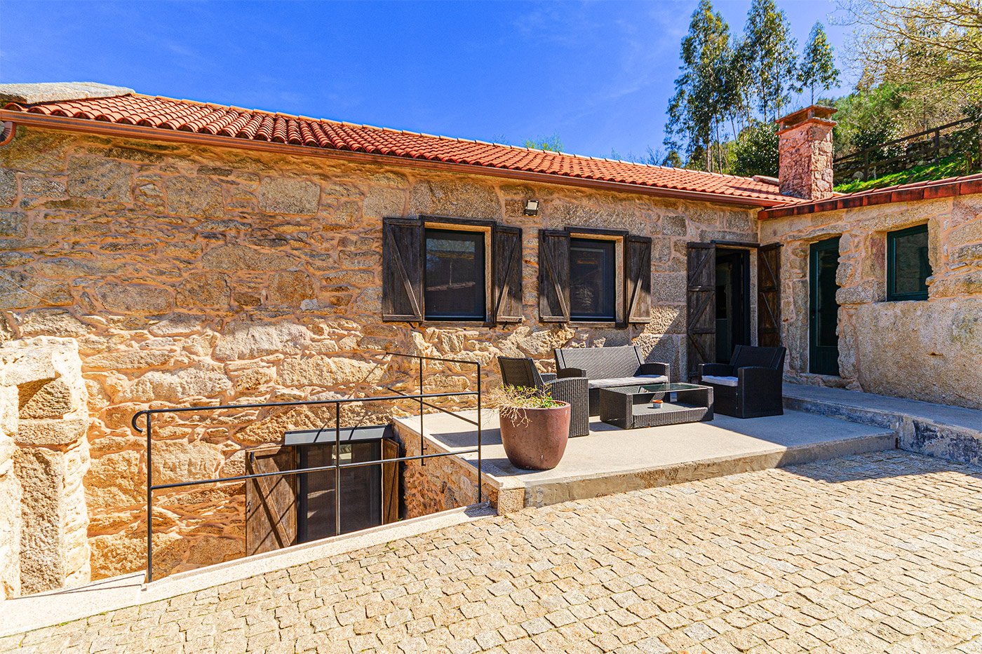 Furnished patio with stairs to lwer level (left)