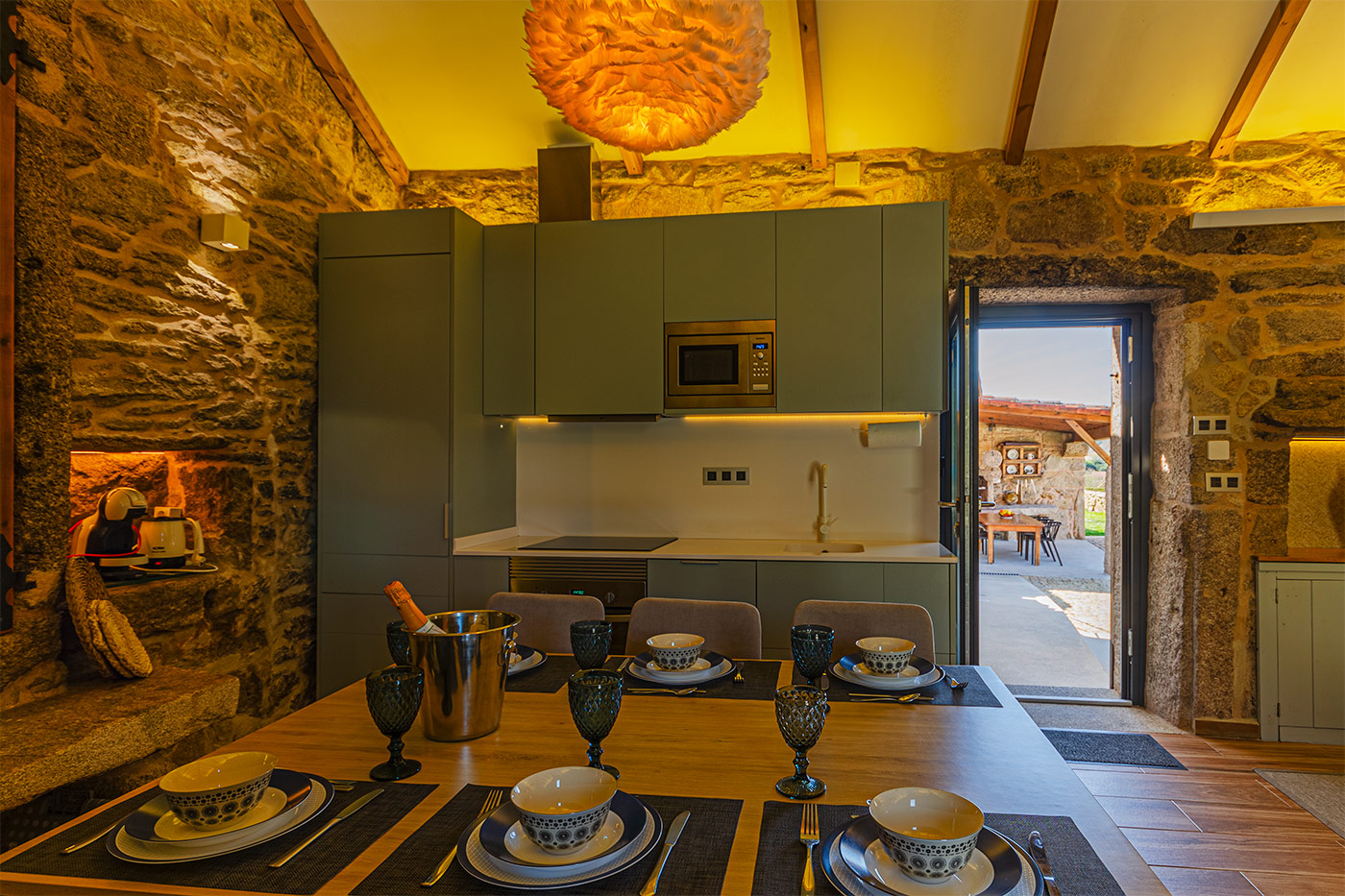 The kitchen is close to the barbecue are which is handy