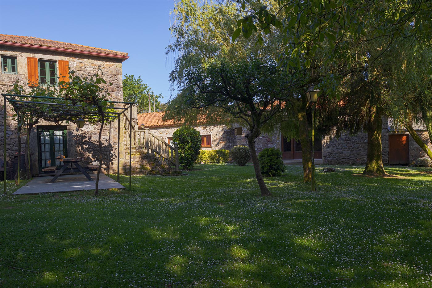 Gardens with natural shade.Games room opposite.