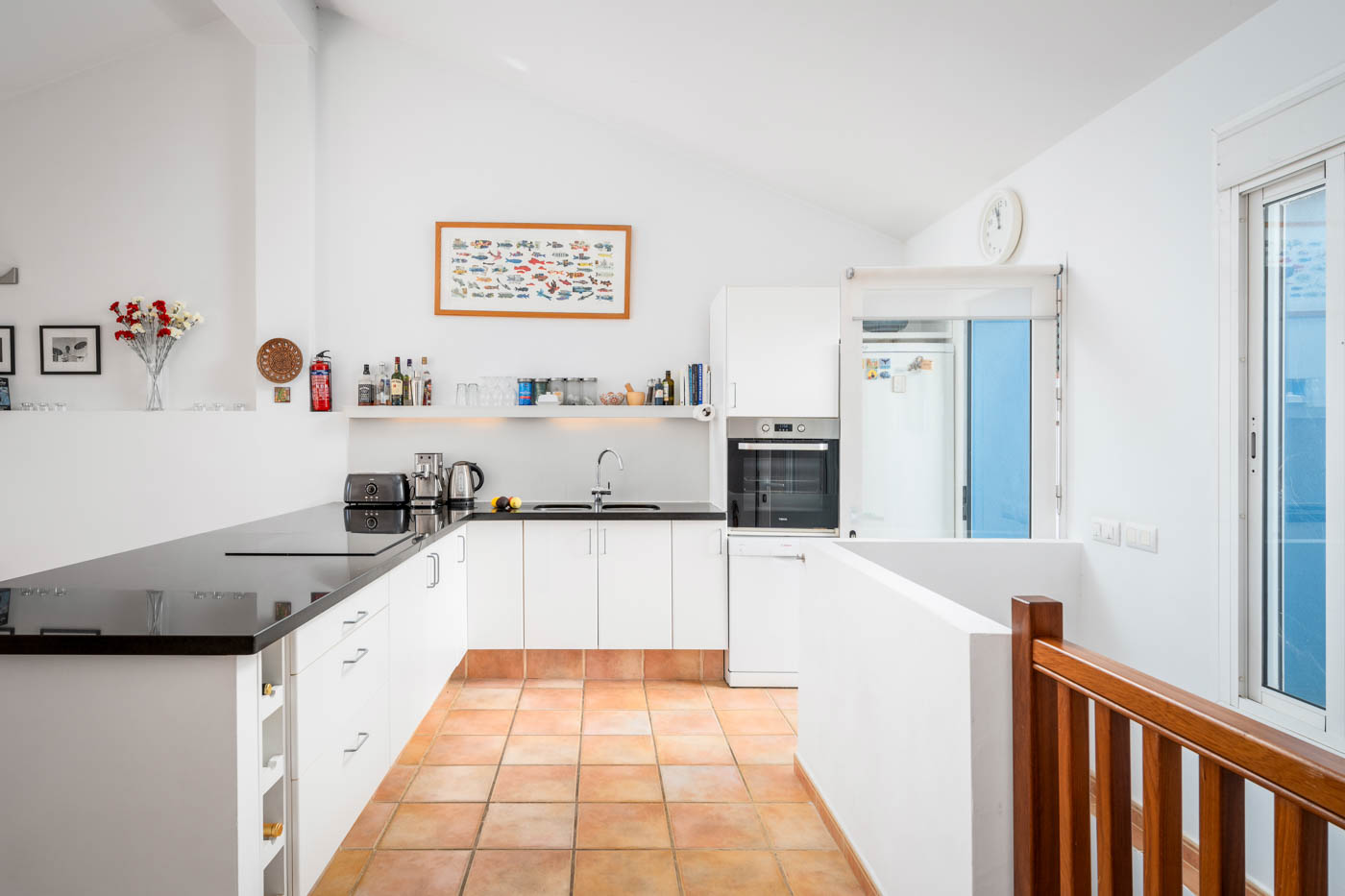From kitchen, there is a door to a furnished patio
