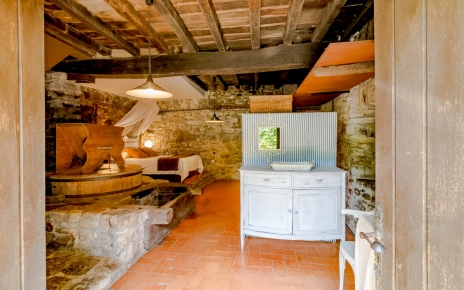 The restored mill is a bedroom on lower floor