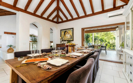Dining area next to kitchen and opening to porch
