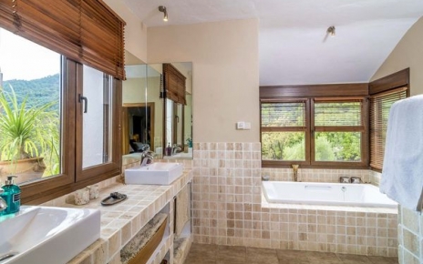En suite bathroom with bath and walk-in shower