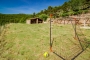 Simple football facilities in a field below the house