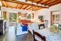Living / dining space with doors to terrace and gardens