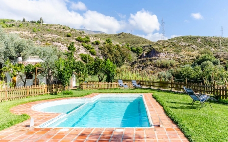 The pool area is fenced