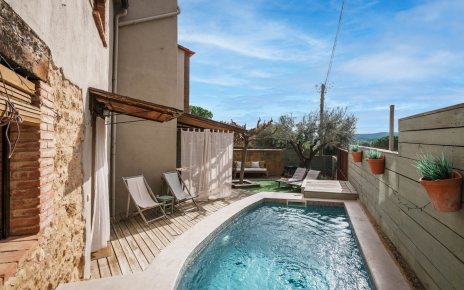 The pool occupies a private corner of the patio