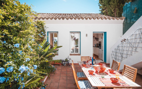 Furnished patio and kitchen with stairs to pool area