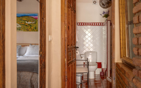 Bedroom next to bathroom